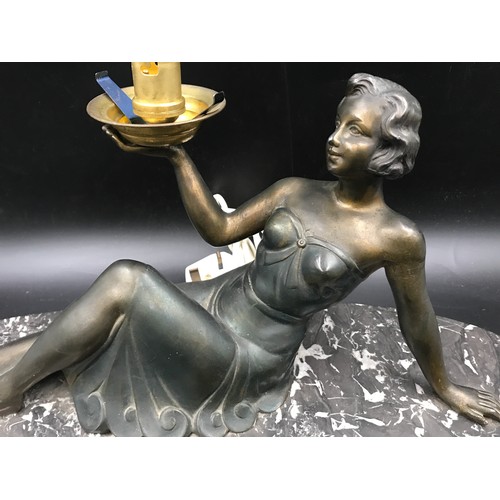 559 - Art Deco style table lamp, bronze effect spelter lady figure on black marble base. 22 h x 45 x 14cms... 