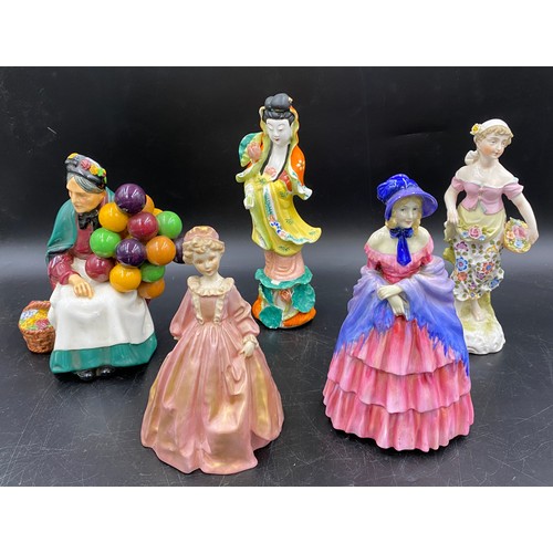 92 - Five figurines to include Royal Doulton The Old Balloon Seller H.N. 1315 20cms h, A Victorian Lady H... 