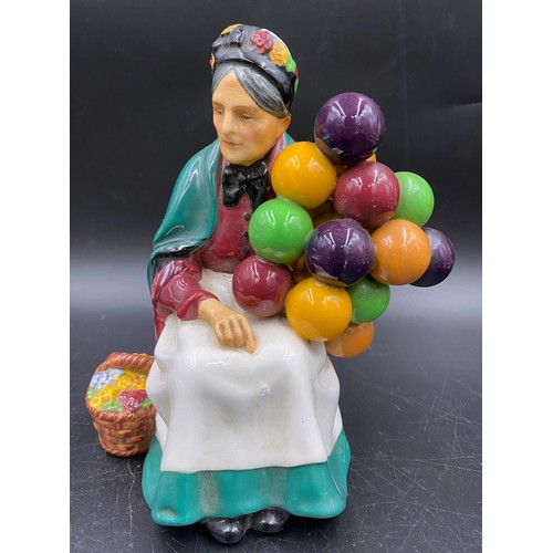 92 - Five figurines to include Royal Doulton The Old Balloon Seller H.N. 1315 20cms h, A Victorian Lady H... 