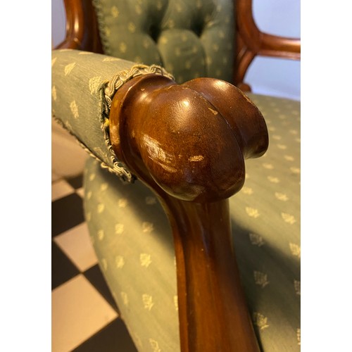 1222 - A Victorian mahogany framed button upholstered armchair with carved back. Height to seat 38cms, heig... 