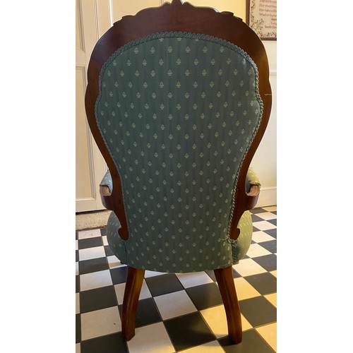 1222 - A Victorian mahogany framed button upholstered armchair with carved back. Height to seat 38cms, heig... 