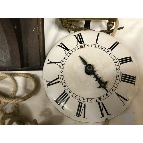 661 - A 19thC brass framed lantern clock for restoration, enamel dial with an oak wall mounted bracket she... 