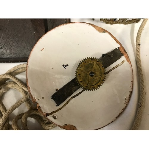 661 - A 19thC brass framed lantern clock for restoration, enamel dial with an oak wall mounted bracket she... 