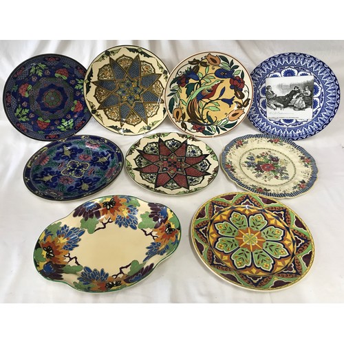 102 - A collection of Royal Doulton decorative plates. Eight approx. 26cms d, one dish 