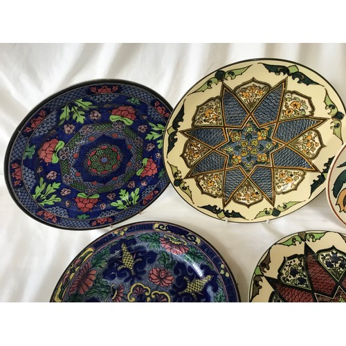 102 - A collection of Royal Doulton decorative plates. Eight approx. 26cms d, one dish 