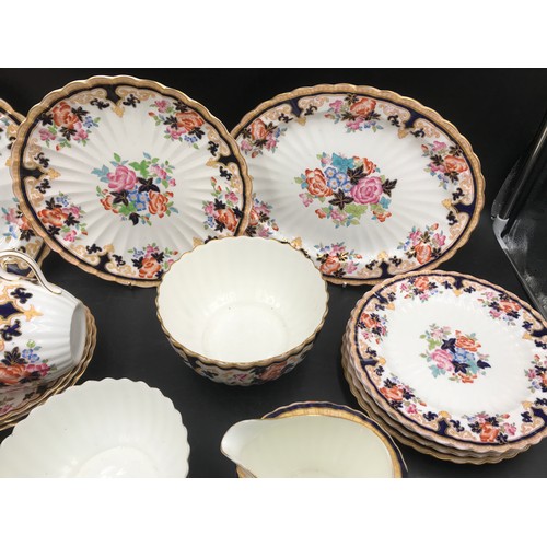 108 - A Brownfield circa 1890 part tea/ dinner ware with floral pattern to include: 2 oval plates 34 and 2... 