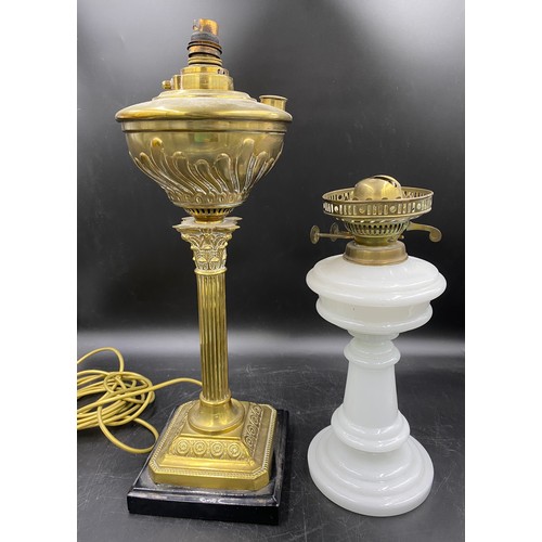 561 - An oil lamp style electric brass table lamp with Corinthian column, slate base and switch 50cms to f... 