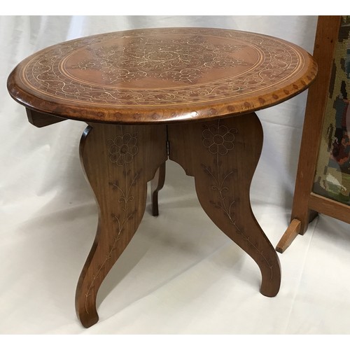 1215 - An Indian hardwood inlaid table with tripod folding base and circular top, 45cms h x 46cms w togethe... 