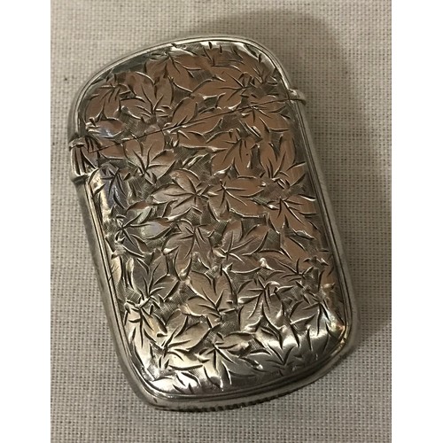 537 - A silver vesta case with leaf decoration and vacant cartouche, GU Birmingham 1894, 19gms.