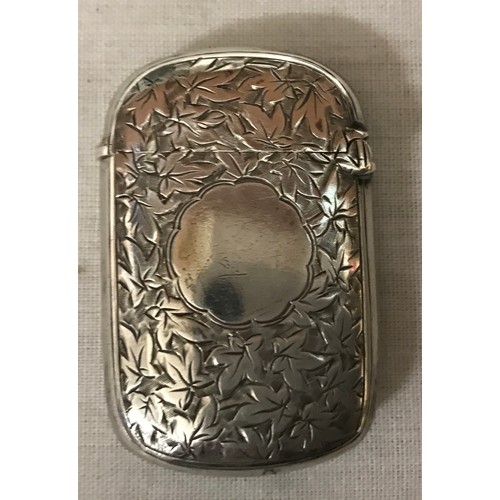 537 - A silver vesta case with leaf decoration and vacant cartouche, GU Birmingham 1894, 19gms.