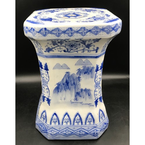 96 - A Chinese blue and white pottery stool. 43cms h x 27cms w.