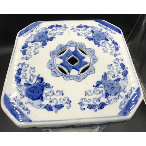 96 - A Chinese blue and white pottery stool. 43cms h x 27cms w.