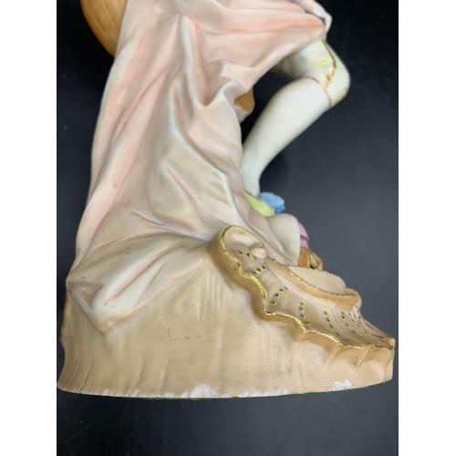 98 - A pair of Continental bisque porcelain figures of a gentleman and lady. 33cms h to base.