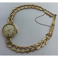 A 9ct gold Baume ladies wristwatch and strap. Total weight 11.8gms.