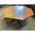 A large Robert ''Mouseman'' Thompson Oak octagonal adzed top and sides table with curved edges to to... 