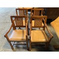 Four Robert ''Mouseman'' Thompson oak carver dining chairs each with lattice carved back and close s... 