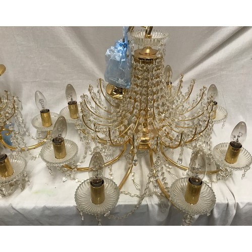 549 - Two glass droplet and brass ceiling light chandeliers. Largest 8 branch approx. 60cms w, height to c... 