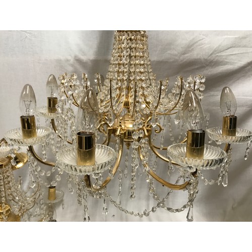 549 - Two glass droplet and brass ceiling light chandeliers. Largest 8 branch approx. 60cms w, height to c... 