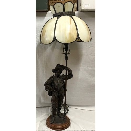 550 - A large spelter figurine bronze effect table lamp of a cavalier gent with halberd staff pole and ony... 