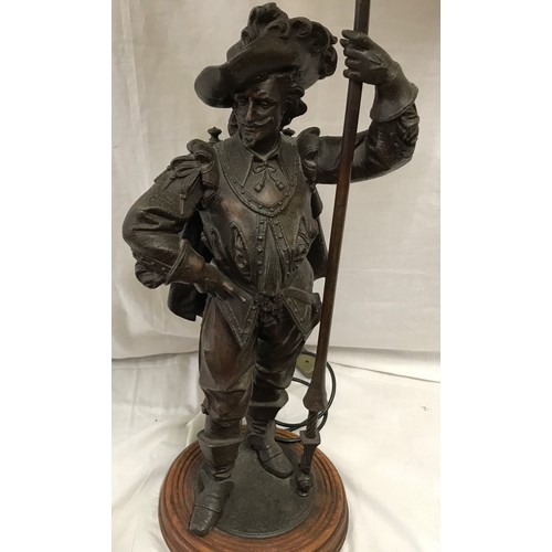 550 - A large spelter figurine bronze effect table lamp of a cavalier gent with halberd staff pole and ony... 