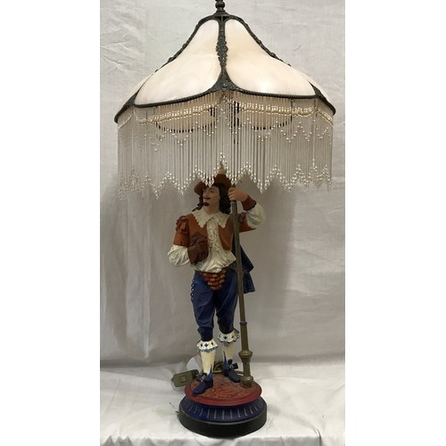 551 - A large painted metal figural table lamp of a cavalier gentleman with halberd staff with pink marble... 