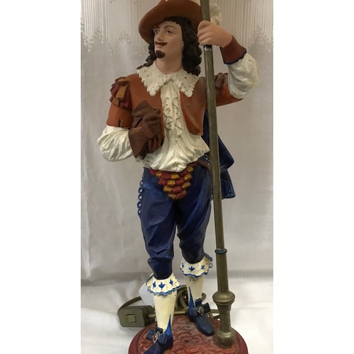 551 - A large painted metal figural table lamp of a cavalier gentleman with halberd staff with pink marble... 