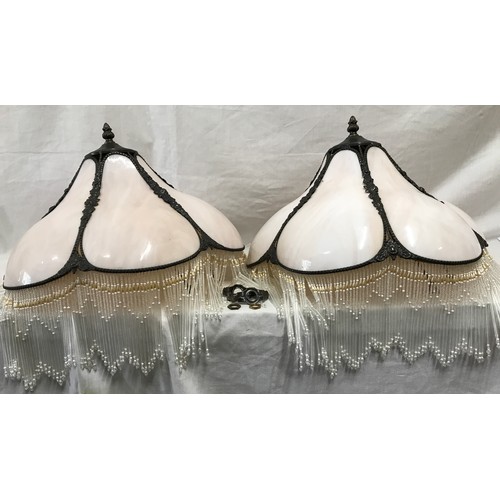 553 - A pair of pink marble and bronze effect lamp shades with glass tassel borders approx. 39cms w.