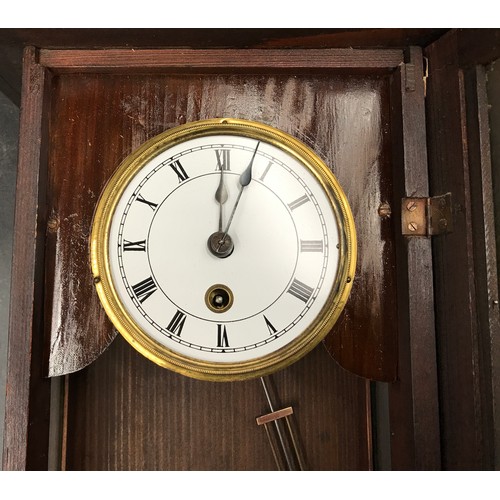 669 - A small walnut veneered cased wall clock 43cms h x 25cms w.