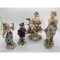Four late 19thC/early 20thC Continental porcelain figures to include a pair Of Samson. Tallest 13cms... 