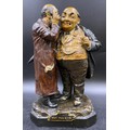 A Johann Maresche painted pottery figure depicting two gentlemen in close conversation. Impressed to... 
