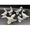 A selection of five white duck figurines comprising one small Lladro 12cms, four Lladro Nao 3 x15cms... 