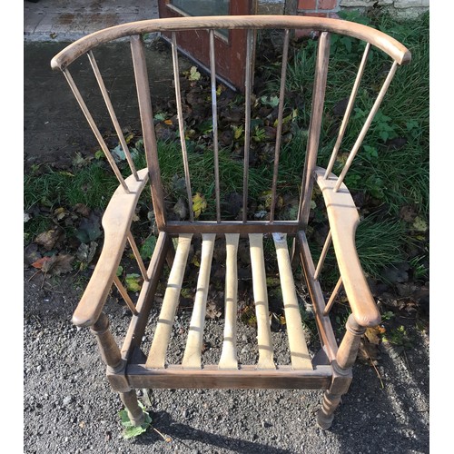 1238 - A beech wood framed stick back armchair. No cushion. Ht to seat 37cms, width at back 84cms, ht to ba... 