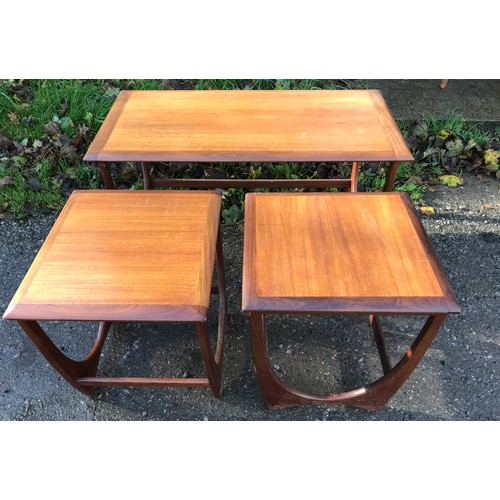 1239 - A G plan teak nest of three, one long table with two beneath. 99cms w x 50cms d x 51cms h.