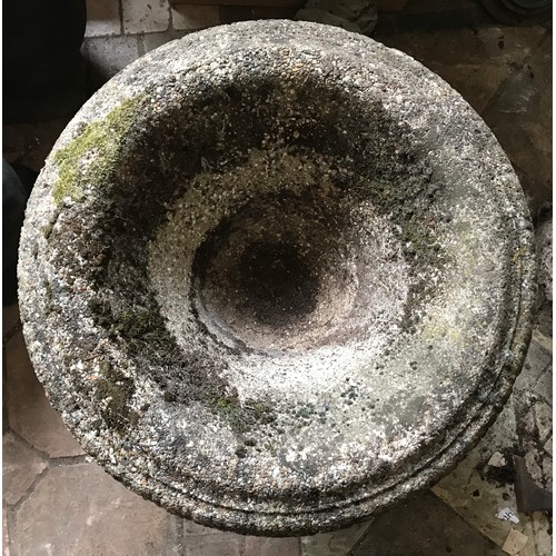 1323 - A reconstituted concrete garden urn on a circular pedestal on a square base approx. 64cms w x 50cms ... 