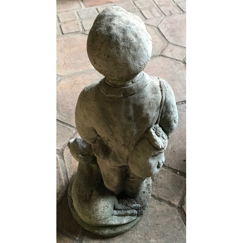 1325 - A concrete garden ornament of a boy and dog. Approx. 56cms h, circular base 26cms d.