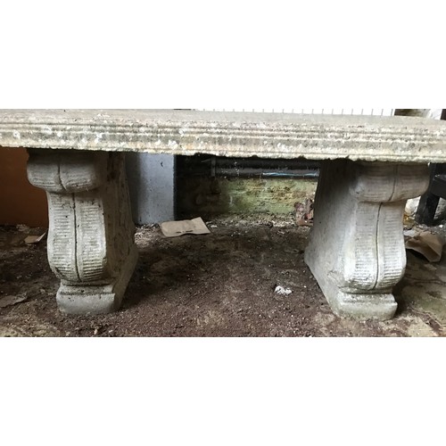 1327 - A concrete garden bench with rectangular top on a twin base decorated with grapes. 105cms w x 41cms ... 