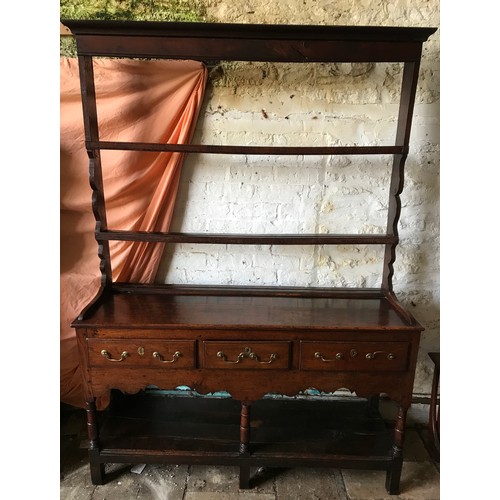 1234 - An 18thC oak welsh dresser with 3 drawer base with brass handles, under shelf and open back top shel... 