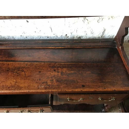 1234 - An 18thC oak welsh dresser with 3 drawer base with brass handles, under shelf and open back top shel... 