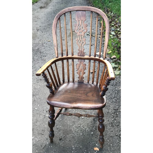 1236 - An oak stick back Windsor armchair. Ht to seat 45cms, ht to back 109cms, width 60cms.