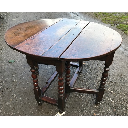 1237 - An early 18thC oak drop leaf gateleg dining table 73cms h, 89cms w, 104cms open.