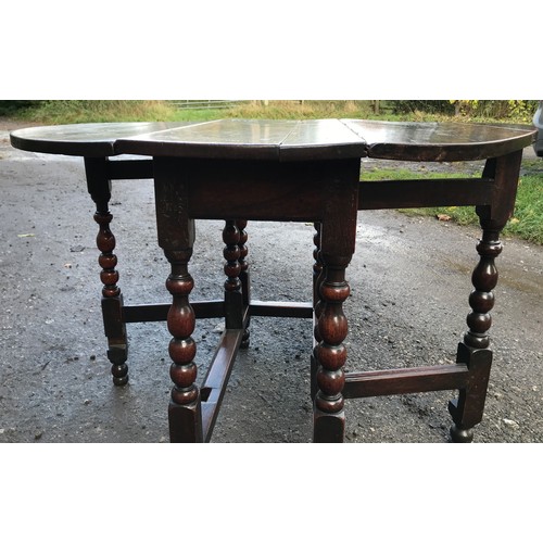 1237 - An early 18thC oak drop leaf gateleg dining table 73cms h, 89cms w, 104cms open.