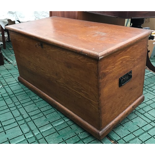 1254 - A large pine chest with handles to side with lock and key closing. Measures 45cms w x 95cmx l x 53cm... 