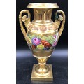A 19thC gilt and floral painted vase, rams head handles. 33 h x 18cms w at handles.