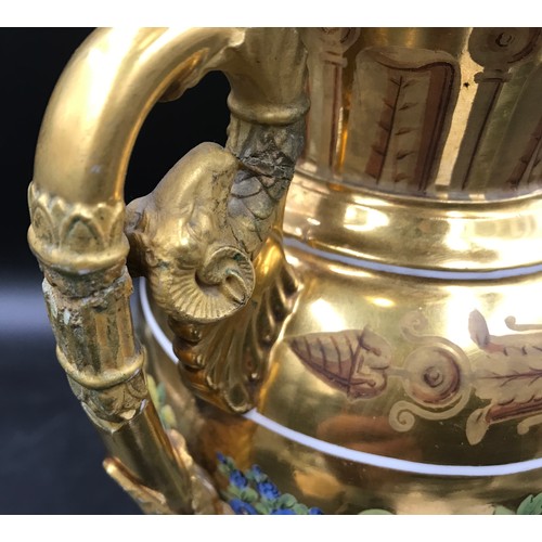 45 - A 19thC gilt and floral painted vase, rams head handles. 33 h x 18cms w at handles.