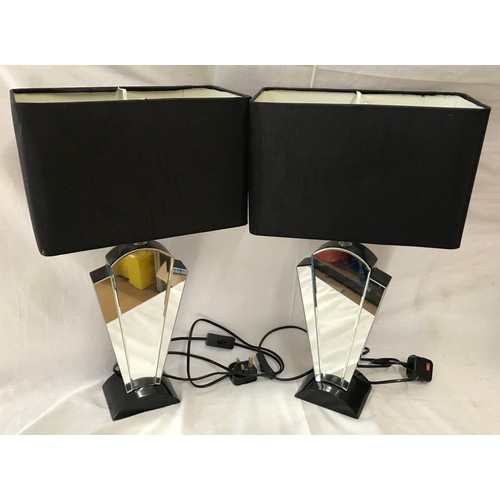 546 - Pair of mirrors black table lamps with rectangular black shades. 52cms h.