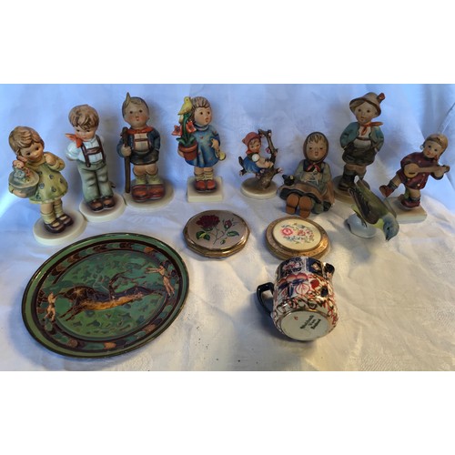 51 - A mixed lot of 9 Hummel figurines. Tallest 14cms h. 2 compacts, small Imari jug, 6cms h and enamelle... 