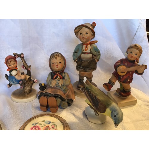 51 - A mixed lot of 9 Hummel figurines. Tallest 14cms h. 2 compacts, small Imari jug, 6cms h and enamelle... 