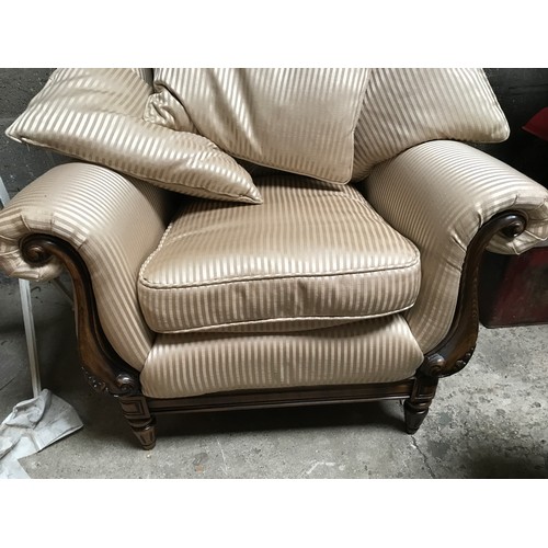 1250 - Medallion Upholstery carved wooden framed scroll arm wing back armchair with footstool and cushions.... 