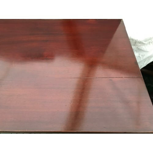 1277 - A mahogany fold-over card table with squared tapered legs. Measures 91cms l x 45cms w x 72cms h.