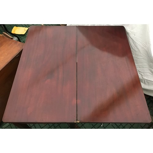 1277 - A mahogany fold-over card table with squared tapered legs. Measures 91cms l x 45cms w x 72cms h.